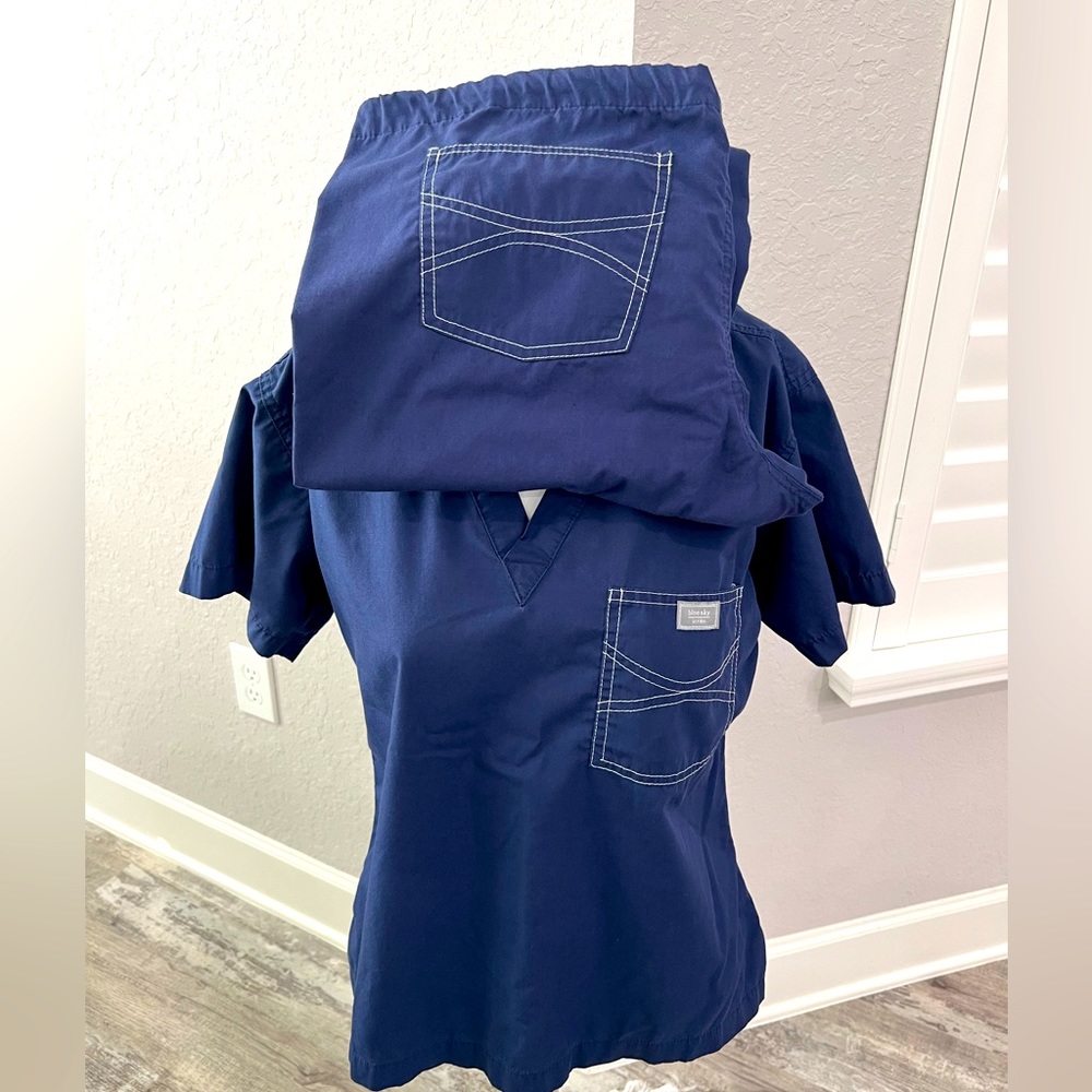 Blue Sky Scrubs set. Top size Medium Pants size small. Great condition.